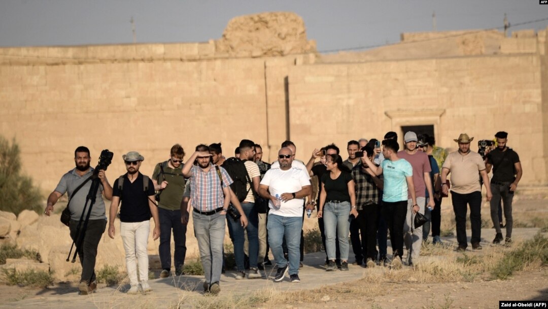 A group of tourists visit the ancient city of Hatra in northern Iraq on Sept. 10, 2022