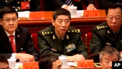 资料照 ：中国国防部长李尚福（中）
