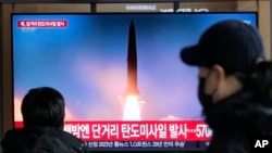 FILE - A TV screen shows a file image of a North Korean missile launch during a news program at the Seoul Railway Station in Seoul, South Korea, Dec. 18, 2023.