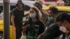 Chalini Thongyot reports during an anti-government protest in Bangkok, Thailand, Oct. 1, 2022. (Tommy Walker/VOA)
