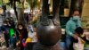Children accompanied by their parents line up to receive China's Sinovac COVID-19 coronavirus vaccine at a community vaccination center in Hong Kong, Feb. 25, 2022. 