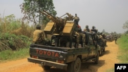 Magari yaliyowabeba wanajeshi wa FARDC wakiwa katika oparesheni dhidi ya waasi. Picha ya AFP