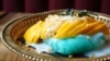 Mango sticky rice is served on Thai traditional golden tray in Sisters Thai Alexandria restaurant in Alexandria, Virginia