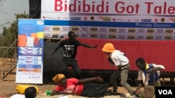 Members of a drama act perform a play depicting domestic violence at the Bidibidi Got Talent show in Yumbe Uganda, Dec. 16, 2017. (H. Athumani/VOA)