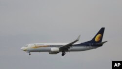FILE - A passenger Airbus of India's Jet Airways prepares for a landing, April 16, 2015, at the Indira Gandhi International airport in New Delhi, India.