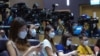 Journalists wearing face masks to help curb the spread of the coronavirus attend a press conference by Hong Kong Chief Executive Carrie in Hong Kong, Aug. 17, 2021.