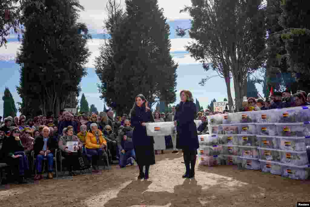 Members of the Association for the Recovery of Historical Memory of Valladolid (ARMH-Valladolid) take part in the burial of 245 people killed by the late Spanish dictator Francisco Franco's forces during the civil war, that were exhumed between 2016 and 2017, at El Carmen's cemetery in Valladolid, Spain.