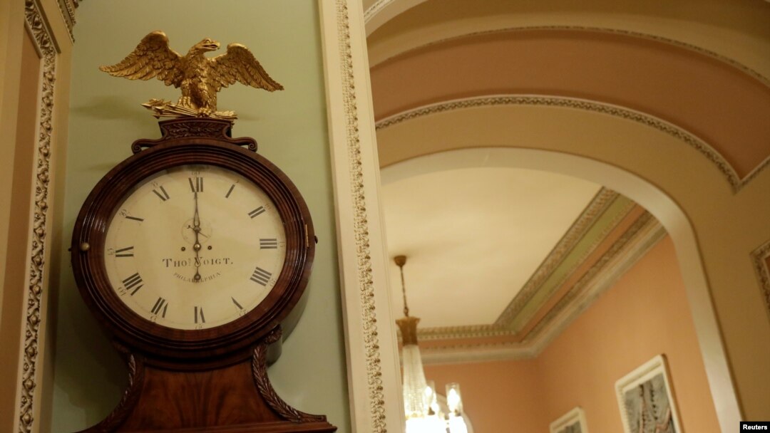 The Ohio Clock shows midnight to begin the government shutdown outside the Senate chamber on Capitol Hill in Washington, Jan. 20, 2018.