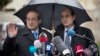 Syrian Deputy Foreign Minister Faisal Mekdad, left, as he arrives for a press briefing with an aide at the UN headquarters in Geneva, Switzerland, Feb. 10, 2014.