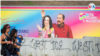  Dos mujeres pasan frente a un cartel con la imagen del presidente Daniel Ortega y su esposa, Rosario Murillo, en Managua.