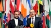 Iran's Ambassador to the IAEA, Reza Najafi (L) and IAEA Deputy Director General, Head of the Department of Safeguards, Tero Tapio Varjoranta talk to the media in Vienna, Austria, Oct. 29, 2013.