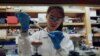 FIA researcher works in a lab at the Duke-NUS Medical School, which is developing a way to track genetic changes that speed testing of vaccines against the coronavirus disease (COVID-19), in Singapore March 23, 2020. (Joseph Campbell/Reuters)