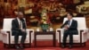 英国外相祁湛明 (左)和中国国家副主席韩正于2023年8月30日在北京人民大会堂出席会议