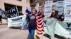 Bobby Bauch, of Dubuque, Iowa, leads cheers for Democratic presidential candidate Elizabeth Warren before the Iowa Democratic Party's Hall of Fame Celebration, June 9, 2019, in Cedar Rapids, Iowa. 