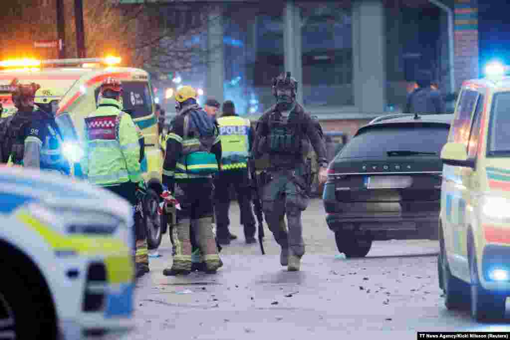 Emergency workers and police officers work at the adult education center Campus Risbergska school after a shooting attack in Orebro, Sweden. At least 10 people have been killed in the shooting, Swedish police said. 