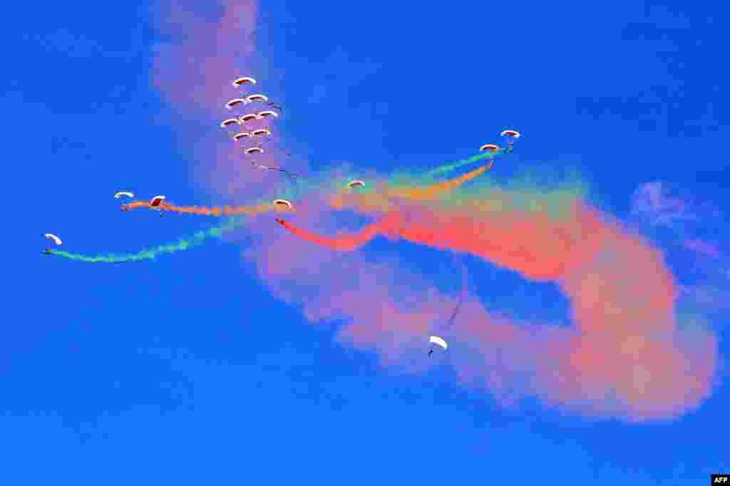 Member of Qatar's air sport committee perform during the Kuwait aviation show in Kuwait City.