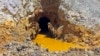 Yellow mine waste water is seen at the entrance to the Gold King Mine in San Juan County, Colorado, August 5, 2015.