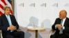 Afghanistan's President Ashraf Ghani (R) listens as U.S. Secretary of State John Kerry speaks during a bilateral meeting at the London Conference on Afghanistan, in London, Dec. 4, 2014.
