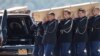 Coffins of the victims of Malaysia Airlines MH17 downed over rebel-held territory in eastern Ukraine, are loaded into hearses on the tarmac during a national reception ceremony at Eindhoven airport, July 23, 2014.