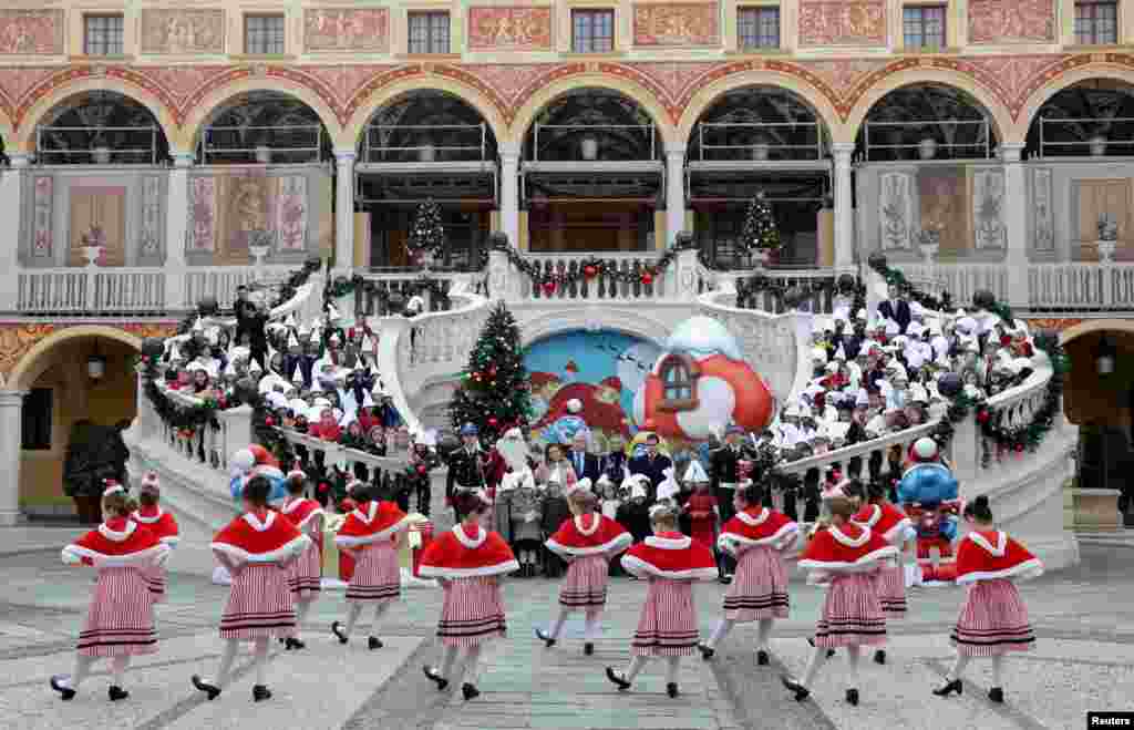 Prince Albert II of Monaco, his wife Princess Charlene and Princess Stephanie's children Camille Gottlieb and Louis Ducruet, attend the traditional Christmas tree ceremony at the Monaco Palace, in Monaco.