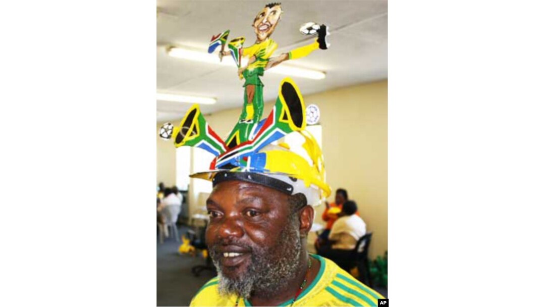 South African fans celebrate the games with makarapas - colorful hats made from everyday materials