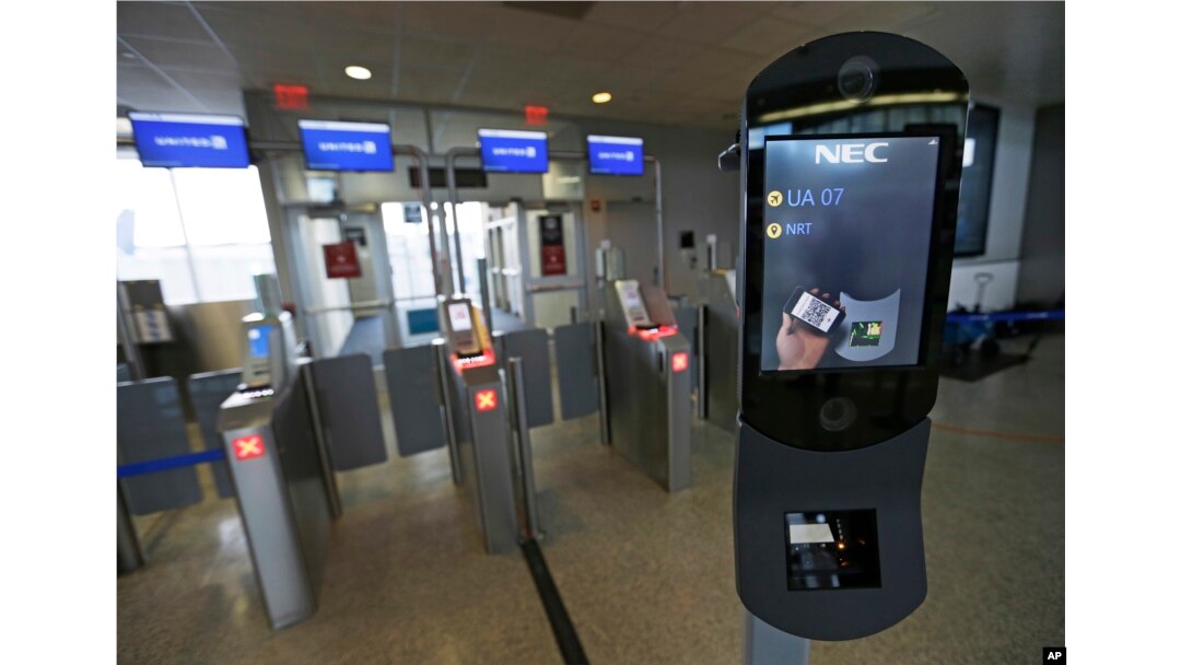 FILE - A U.S. Customs and Border Protection facial recognition device is ready to scan another passenger at a United Airlines gate.