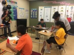This undated photo shows special education teacher and students at Kennedy Middle School in Gallup, N.M., celebrating a student's birthday.