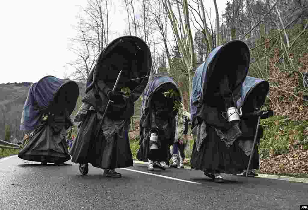 Revelers in costumes take part in the traditional carnival of Zubieta, in the northern Spanish province of Navarre.