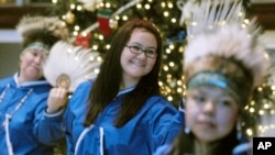  Debra Dommek, Inupiaq, center, performs traditional dances at the Alaska Native Heritage Center in Anchorage, Alaska Saturday, Dec. 16, 2006.