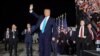 President Donald Trump waves before boarding Air Force One for a trip to Charlotte, NC, to deliver remarks on health care, Sept. 24, 2020, in Andrews Air Force Base, Md. 