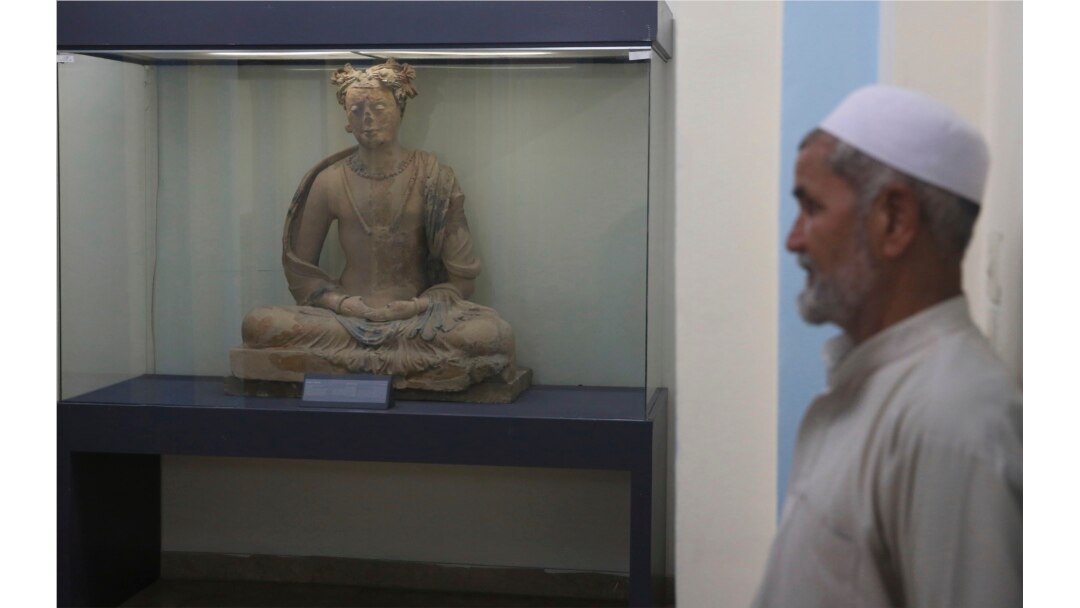 A complete figure of a seated Buddha dating from the third or fourth century is on display at the National Museum of Afghanistan in Kabul, Afghanistan, Aug. 17, 2019.