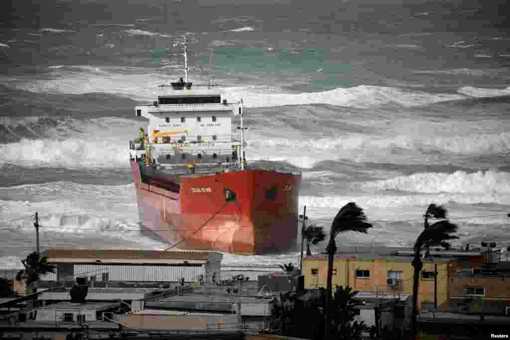 A cargo vessel is seen swept away by a storm in the Mediterranean Sea close to Ashdod's port in southern Israel.