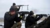 Ukrainian servicemen fight at their position near Lysychansk, in the Luhansk region, Jan. 29, 2015.