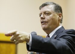 FILE - U.S. Rep. Tom Cole, R-Okla., shown at a town hall meeting in Moore, Oklahoma, in Aug. 2015.