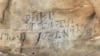 An inscription on the Manitou Cave wall, written in the Cherokee syllabary, identifies writers as stickball team leader and is dated April 30, 1828. Photo courtesy Beau Carroll, archaeologist, Eastern Band of Cherokee.