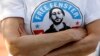 FILE - In this June 5, 2021, photo, a person wears a T-shirt calling for the release of US journalist Danny Fenster from detention in Myanmar, in Huntington Woods, Michigan.