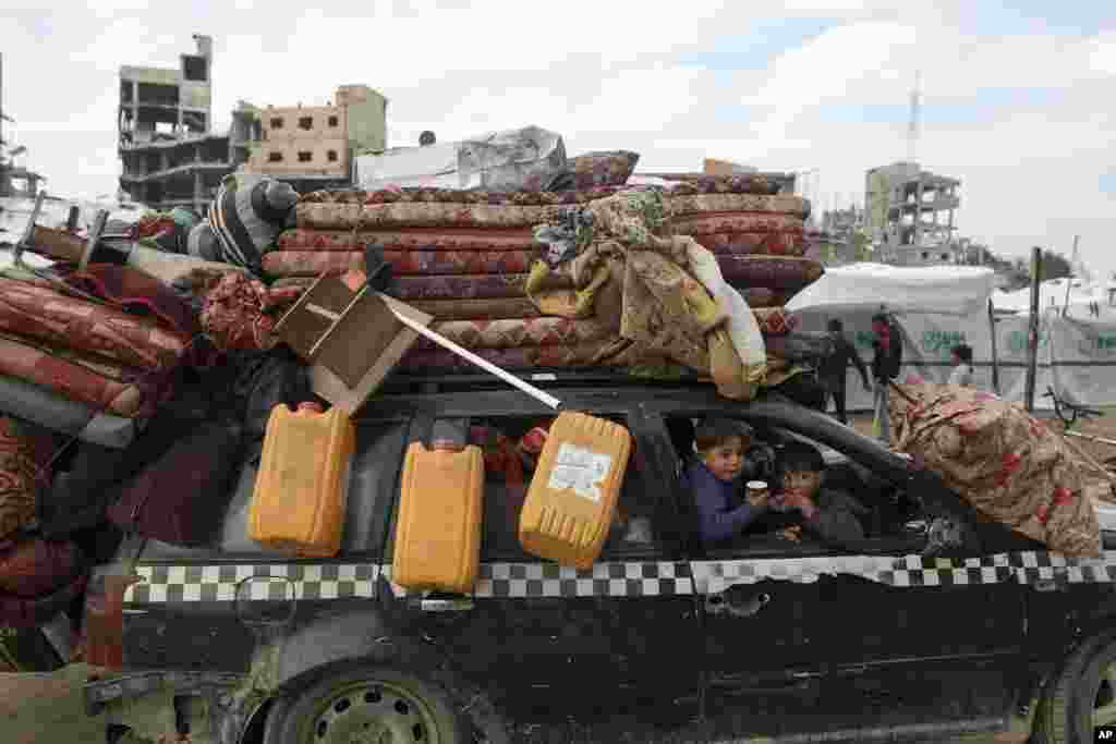 Displaced Palestinians arrive in the northern Gaza Strip, following Israel's decision to permit thousands of them to go back for the first time since the early weeks of the 15-month war with Hamas.