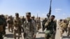 Iran-backed forces allied with Iraqi forces in Ouja, on the southern outskirts of Tikrit, March 26, 2015. The U.S. conditioned its entry into Iraq's battle to retake Tikrit from IS on the withdrawal of Shiite militias from the clearing operation. 