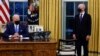 President Biden signs executive orders on immigration reform inside the Oval Office at the White House in Washington