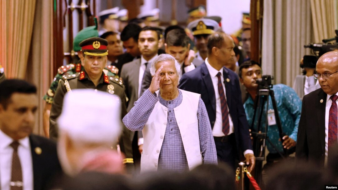 FILE PHOTO: Nobel laureate Muhammad Yunus salutes to the attendees upon arrival at the Bangabhaban to take oath as the head of the interim government