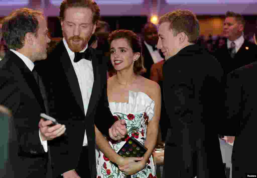 Actress Emma Watson, actor Damian Lewis (left), who stars in the series "Homeland" and "Billions" attend the White House Correspondents' Association annual dinner in Washington, April 30, 2016.