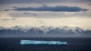 FILE - A polar bear stands on a floating ice patch in the Franklin Strait in the Canadian Arctic Archipelago, July 22, 2017. 