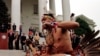 Chickahominy Indian Preston Adkins preforms a ritual dance for Va. Gov. Jim Gilmore, during the annual tax tribute at the Capitol in Richmond, Va., Wednesday Nov. 24, 1999. Virginia Indian tribes have been paying the annual tax tribute since the treaty of