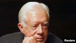 FILE - Former U.S. President Jimmy Carter meets Aviva and Noam Shalit (not seen), parents of abducted Israeli soldier Gilad Shalit, in Jerusalem April 13, 2008.