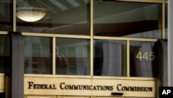 FILE - This June 19, 2015, file photo, shows the Federal Communications Commission building in Washington. FCC Chairman Ajit Pai this month announced cuts to phone subsidies that could disproportionately impact Tribes.