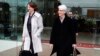Head of the U.S. delegation, Under Secretary of State Wendy Sherman (R), and an unidentified person leave a hotel in Vienna, Feb. 17, 2014.