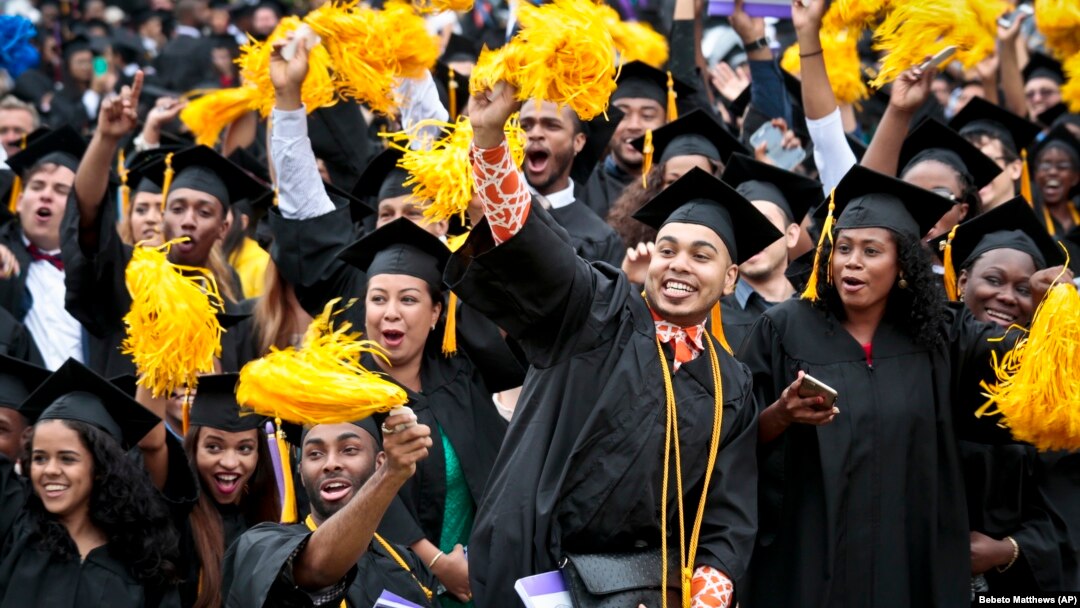 Graduating students in the Class of 2016 at City College of New York cheer.