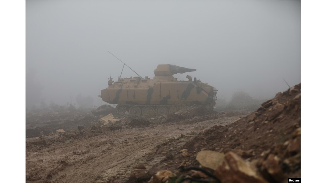 FILE - A Turkish military tank is seen near Mount Barsaya, northeast of Afrin, Syria, Jan. 23, 2018. Five Turkish soldiers died Saturday in the Afrin area when their tank was attacked.