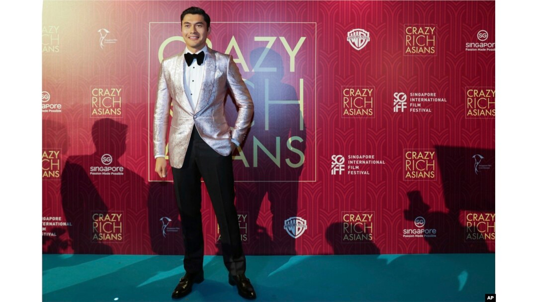 Actor Henry Golding poses as he arrives for the red carpet screening of the movie "Crazy Rich Asians," Aug. 21, 2018, in Singapore.