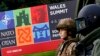 Mannequins of British soldiers dressed in combat gear are displayed at the entrance of the golf course of the Celtic Manor Hotel ahead of the NATO summit in Newport, Wales, September 3, 2014.
